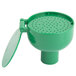 A green plastic dustcover with holes for a T&S eyewash unit.