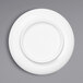 A close-up of an Elite Global Solutions Ming white melamine plate with a white rim.