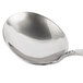 A close-up of a Bon Chef Reflections bouillon tasting spoon with a silver handle.