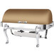 An Eastern Tabletop Queen Anne rectangular bronze coated stainless steel roll top chafer on a table.