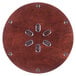A circular wooden surface with silver metal rivets.