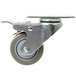 A Baker's Mark swivel plate caster with a metal wheel.