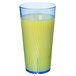 A Thunder Group Belize blue polycarbonate tumbler with yellow liquid and a blue rim.