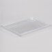 A clear plastic container lid on a white background.