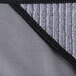 A Unger Ninja Microfiber cloth in gray and black.