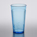 A close-up of a Thunder Group blue polycarbonate tumbler with a wavy design.