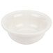 A Hall China pot pie baking bowl in white ceramic with a handle.