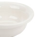 A Hall China ivory pot pie baking bowl with a white rim.
