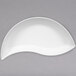 A white bowl with a curved shape.