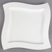 A Villeroy & Boch white square porcelain plate with a wavy design on the edge.