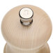 A Chef Specialties natural maple salt mill with a white letter s on the metal knob.