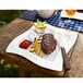 A Villeroy & Boch white porcelain grill plate with steak and fries on it.