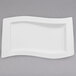 A Villeroy & Boch white porcelain platter with a curved edge.