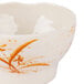 A white melamine bowl with orange and brown orchid designs.