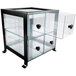 A glass cabinet with Cal-Mil Soho clear drawers.