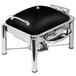 An Eastern Tabletop black and silver stainless steel chafer with a lid on a table.