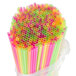 A plastic bag filled with colorful 20" extra-long neon drinking straws.