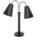 An Eastern Tabletop black freestanding heat lamp with two adjustable lamps with hammered cone shades.
