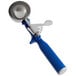 A blue and silver metal Vollrath Jacob's Pride ice cream scoop with a thumb press.