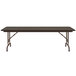 A Correll walnut melamine top folding table with metal legs.