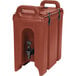 A white Cambro 2.5 gallon insulated beverage dispenser with a red plastic container and a handle.