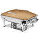A rectangular stainless steel chafer with a bronze lid on a table.