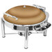A round stainless steel chafing dish with a bronze lid and stand.