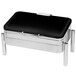 A black and silver rectangular chafer with a hinged dome cover on a pillar'd stand.