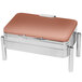 An Eastern Tabletop rectangular stainless steel chafer with a copper lid on a table in an outdoor catering setup.