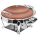 A round copper coated stainless steel chafing dish with a lid and silver stand.