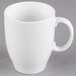 A close up of a Libbey Alpine White porcelain mug with a white handle.