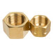 A close-up of brass nuts on a white background.