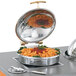 A Vollrath stainless steel chafing dish with pasta inside.