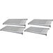 A white metal grate with holes for four grey Cambro Camshelving shelves.