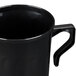 A black Fineline Flairware plastic coffee mug with a handle.
