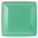 A Tuxton Concentrix Cilantro square china plate with a white background and square design, with a green border.