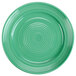 A close-up of a Tuxton Concentrix cilantro green plate with a white spiral pattern.