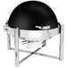 An Eastern Tabletop black and silver round chafer on a table with a roll top lid.