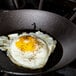 A Lodge carbon steel frying pan with a fried egg.