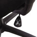 A close-up of a black OIF swivel office chair.