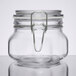 A clear glass Libbey Garden Jar with a metal clamp lid.