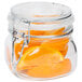 A Libbey glass jar filled with orange slices and a clamp lid.