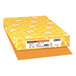 A yellow box of Astrobrights Cosmic Orange color paper with white label.