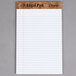 A white TOPS legal pad with narrow ruled paper.