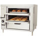 Bakers Pride Countertop Liquid Propane Oven with trays of pastries inside.