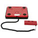 A red and black Rubbermaid Pelouze digital receiving scale with a cord attached to it.