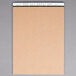 The front of a white TOPS Docket writing tablet with brown paper and white text on the cover.