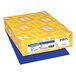 A yellow box with white and blue labels for Astrobrights Blast-Off Blue paper.