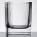 A close up of a Libbey customizable rocks glass with a square bottom.