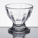 A clear glass Libbey sundae dish with a small rim.